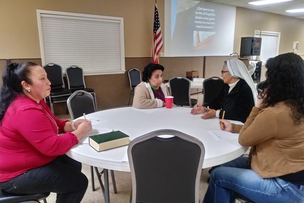 Sister Domitila Gonzalez Flores, MCP, talks with parishioner Esthela Garlinghouse and others Jan. 22 at St. Albert Church in Heber Springs for a Synod listening session. Top concerns are Masses celebrated in Spanish and more faith formation opportunities.