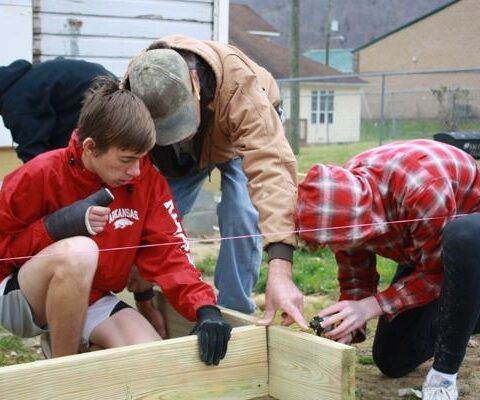 OCA students help Hand-in-Hand Ministries in Auxier, Ky., build a front porch for a home  during their sophomore mission trip March 23-24, 2022.