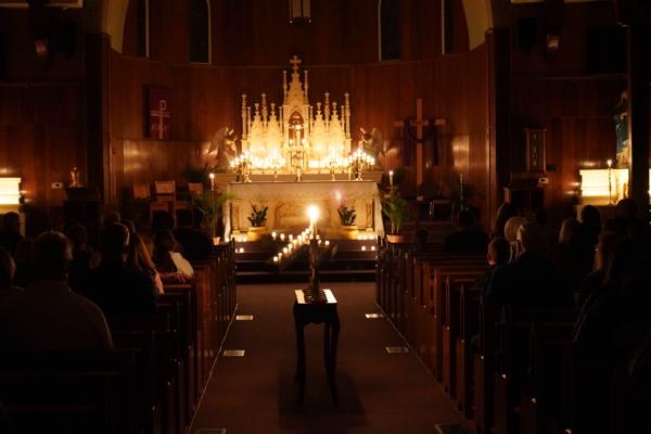Immaculate Heart of Mary Church in North Little Rock (Marche) starts the service lit with candles during Tenebrae, which means &ldquo;darkness&rdquo; in Latin, April 13. Aprille Hanson Spivey photo.
