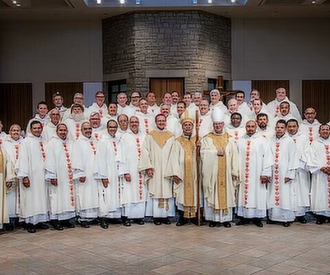 Bishop Taylor stands with the 20 men who were ordained as deacons June 25 at St. Vincent de Paul Church in Rogers. An earlier ordination Mass was held June 11 in Little Rock, making this the largest deacon class ever for the Diocese of Little Rock.