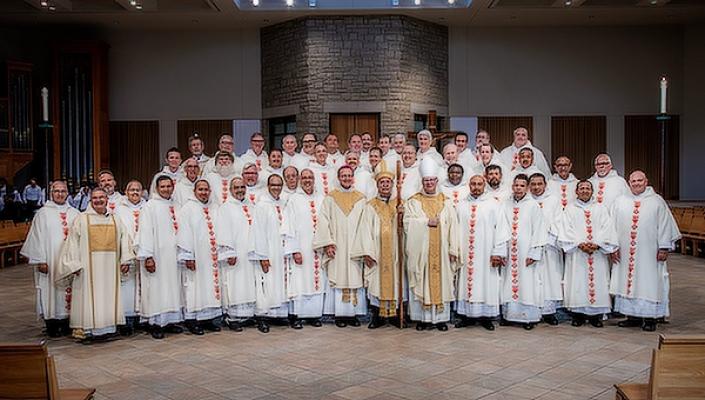 Bishop Taylor stands with the 20 men who were ordained as deacons June 25 at St. Vincent de Paul Church in Rogers. An earlier ordination Mass was held June 11 in Little Rock, making this the largest deacon class ever for the Diocese of Little Rock.