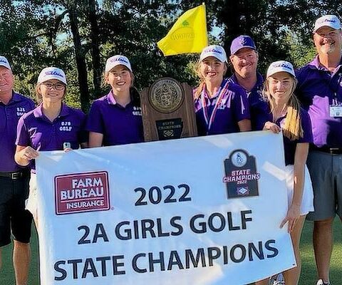 St. Joseph Lady Bulldogs show off the 2A state championship hardware. They are assistant coach Brent Breeding (left), Avery White, Kaitlyn Kordsmeier, Presli Webb, assistant coach Lindell Atkinson, Allie Evans and head coach Mike Prall.