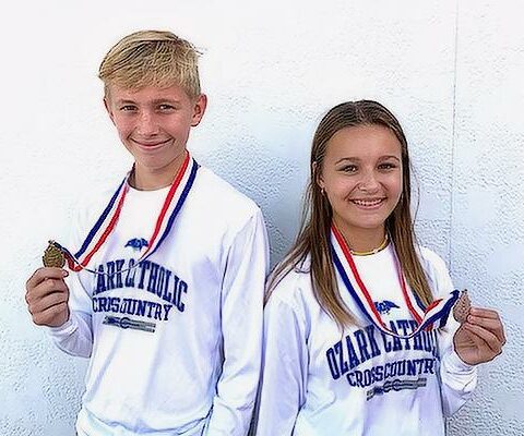 Ozark Catholic Academy sophomore Isaac Pohlmeier and his sister Clare, a freshman, came in first and second place, respectively, at the 1A state cross country championships Nov. 3 in Hot Springs.