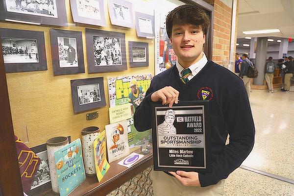 Catholic High senior Miles Marlow displays the Ken Hatfield Sportsmanship Award Dec. 2. Marlow was recognized for his team-first mentality and positive attitude as a career backup linebacker for the Rockets.