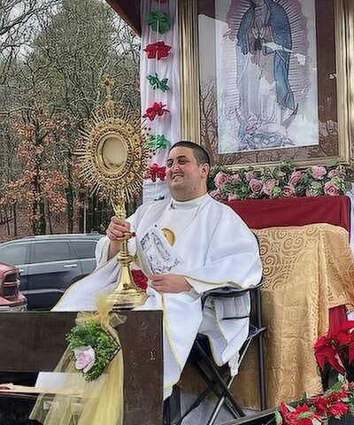 Father Alejandro Puello, pastor of St. Anne Church in North Little Rock, joins the two-mile procession, rosary and exposition of the Blessed Sacrament, carrying a 40-pound monstrance Dec. 11.