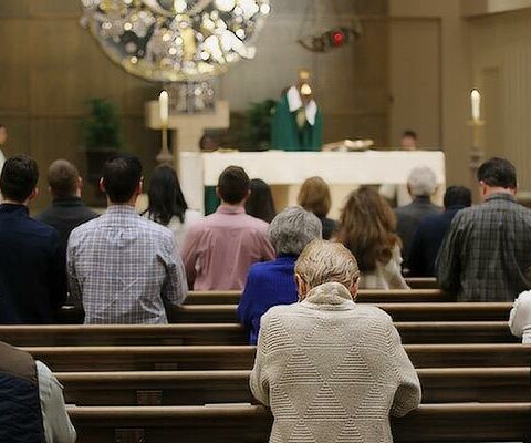 Parishioners pray during Mass Feb. 5 at Christ the King Church in Little Rock. Total Mass attendance numbers in Arkansas improved following the height of the COVID-19 outbreak but have not returned to pre-pandemic levels.