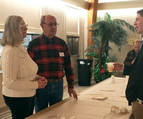 Mary and Glen Stuttgen chat with parishioner Garrett Bannister as they serve coffee at Sacred Heart of Mary Church in Barling on Donut Sunday, March 5.