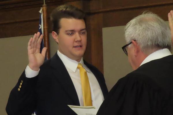 Dayton Myers, deputy grand knight for Knights of Columbus Council #6419 in Hot Springs, is sworn in Jan. 1 to the Garland County Quorum Court by Division 3 Circuit Court Judge Lynn Williams.