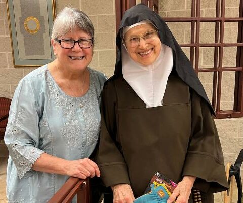 Paula Marinoni stands with her aunt, Mother Virginia Marie, at her 89th birthday in October 2022 at the monastery of Carmel of Port Tobacco in La Plata, Md. The monastery print shop has produced tens of thousands of prayer cards for Paula's ministry.