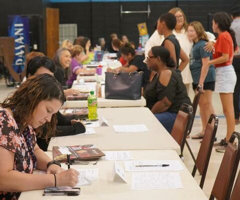 Parents and students attend registration for the new school year at North Little Rock Catholic Academy Aug. 8.