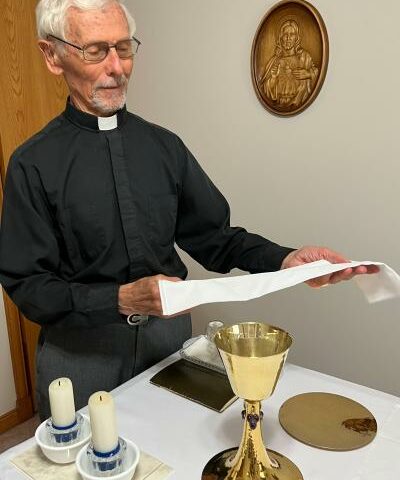 Father Stan Swiderski smiles in the chapel at his Mountain Home residence Aug. 22. On Oct. 11 he will mark his 60th anniversary of priesthood. He was only 16 when he joined the seminary in his native Poland.