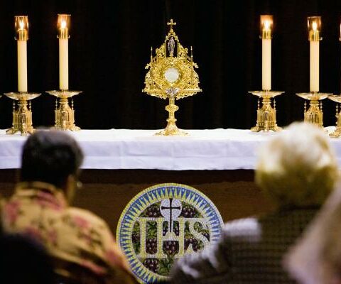 People gather for Eucharistic adoration in this file photo from May 2006.