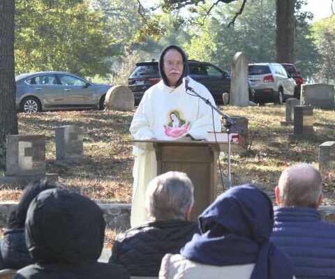 Bishop Anthony B. Taylor delivers his homily on grief and loss at Calvary Cemetery in Little Rock during the All Souls Mass Nov. 2. More than 100 Catholics were in attendance.