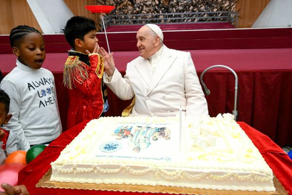 Pope Francis is joined on his 87th birthday by children assisted at the Vatican's pediatric clinic in the Paul VI Hall Dec. 17, 2023.