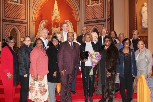 Rosalyn Pruitt stands with family, friends and members of the many organizations she is involved in after receiving the 2024 Daniel Rudd Memorial Award at the Martin Luther King Jr. Mass Jan. 13.
