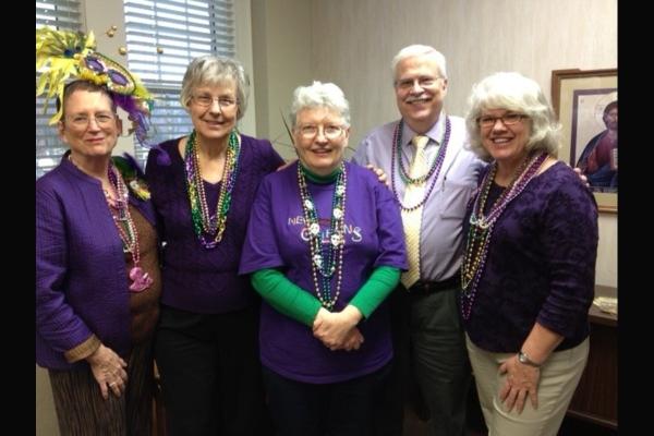 Former staff of Little Rock Scripture Study gets ready for the diocesan employee Mardi Gras party in 2013. They are Nancy Lee Walters (from left), 
the late Lilly Hess, Sister Susan McCarthy, Cliff Yeary and Cackie Upchurch.