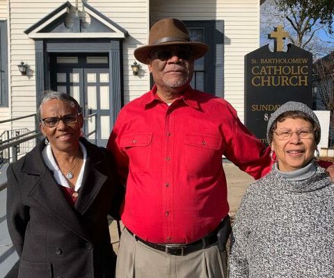Angela Gillam Guimont (left), Lee Lindsey (center) and Patricia Gillam Cook (right) stand outside St. Bartholomew Church Jan. 28. The trio were three of the first Black graduates of integrated parochial schools in Little Rock during the 1960s.